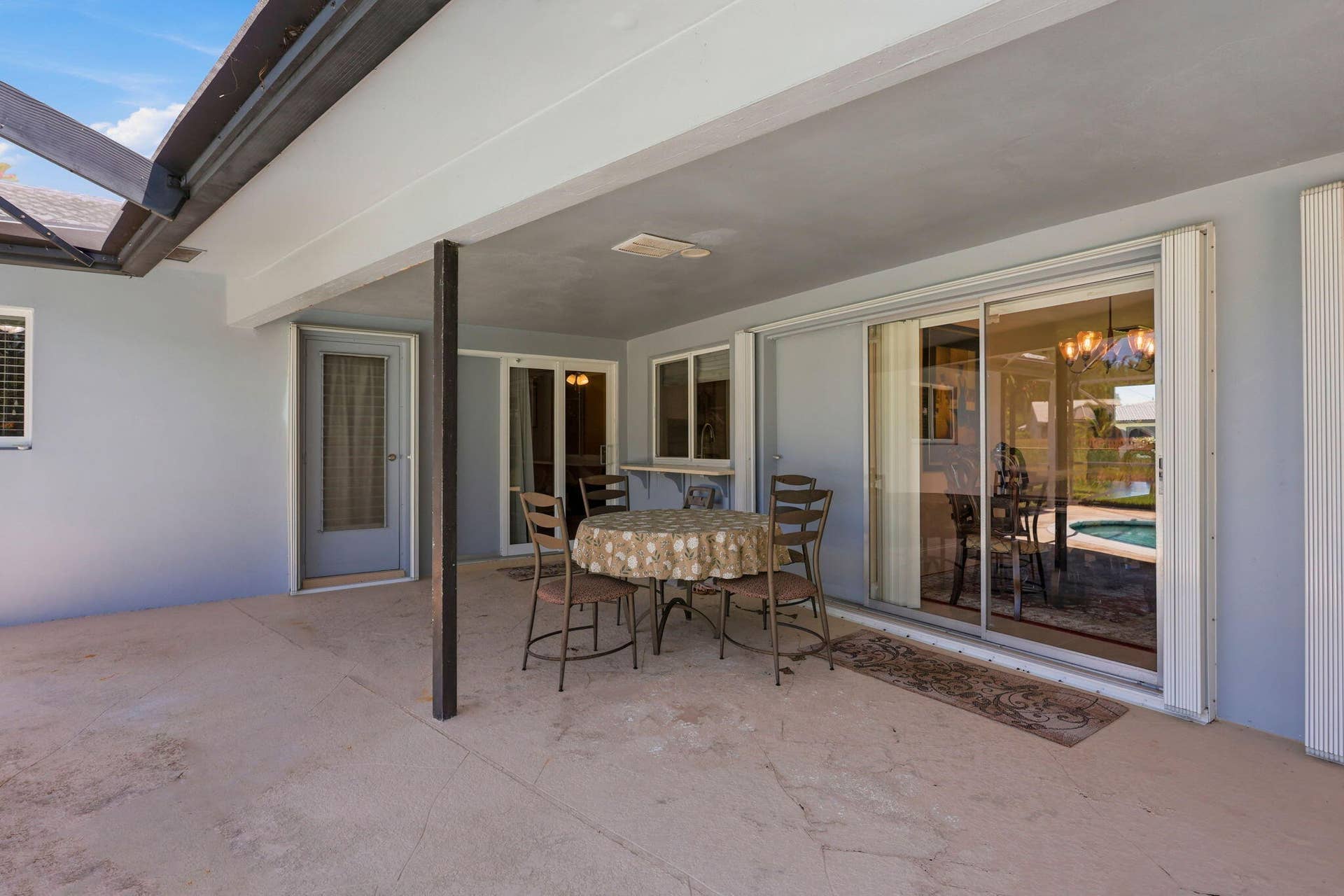 115 Orchard Ridge Lane, Boca Raton, FL 33431 Screen enclosed patio/pool with large overhang.