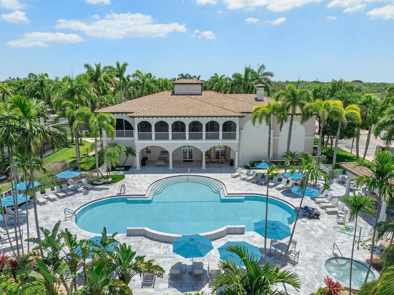 12390 NW 78th Manor, Parkland, FL 33076 The Commons clubhouse swimming pool & private patio & hot tub.