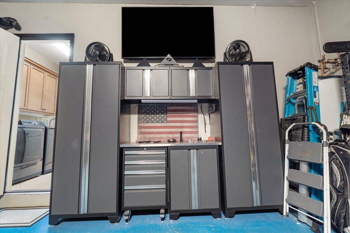 12390 NW 78th Manor, Parkland, FL 33076 This tool cabinet and drawers stays with the purchase of the house, Also included is a full house generator,
