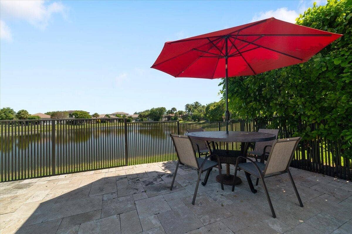 12390 NW 78th Manor, Parkland, FL 33076 Sit back and relax at one of the pretty shaded areas overlooking the tranquil lake,