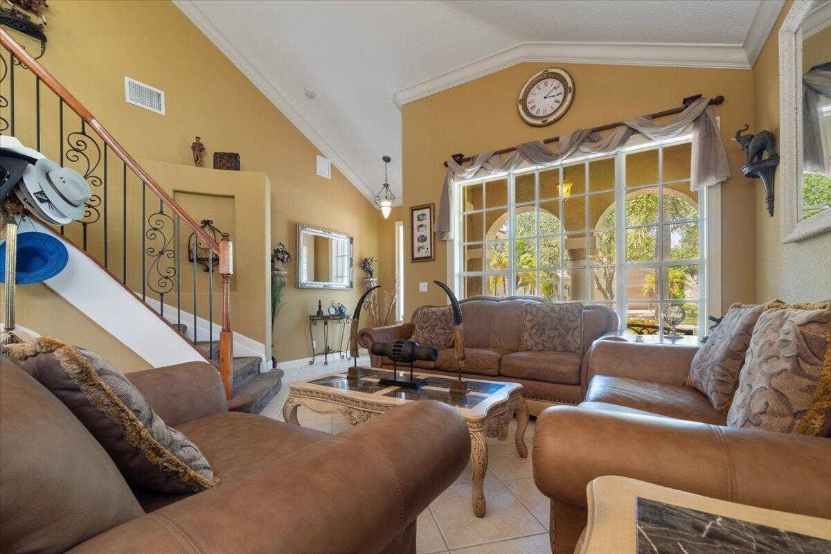 12390 NW 78th Manor, Parkland, FL 33076 All the pretty windows are hurricane protected with accordion shutters throughout the house,