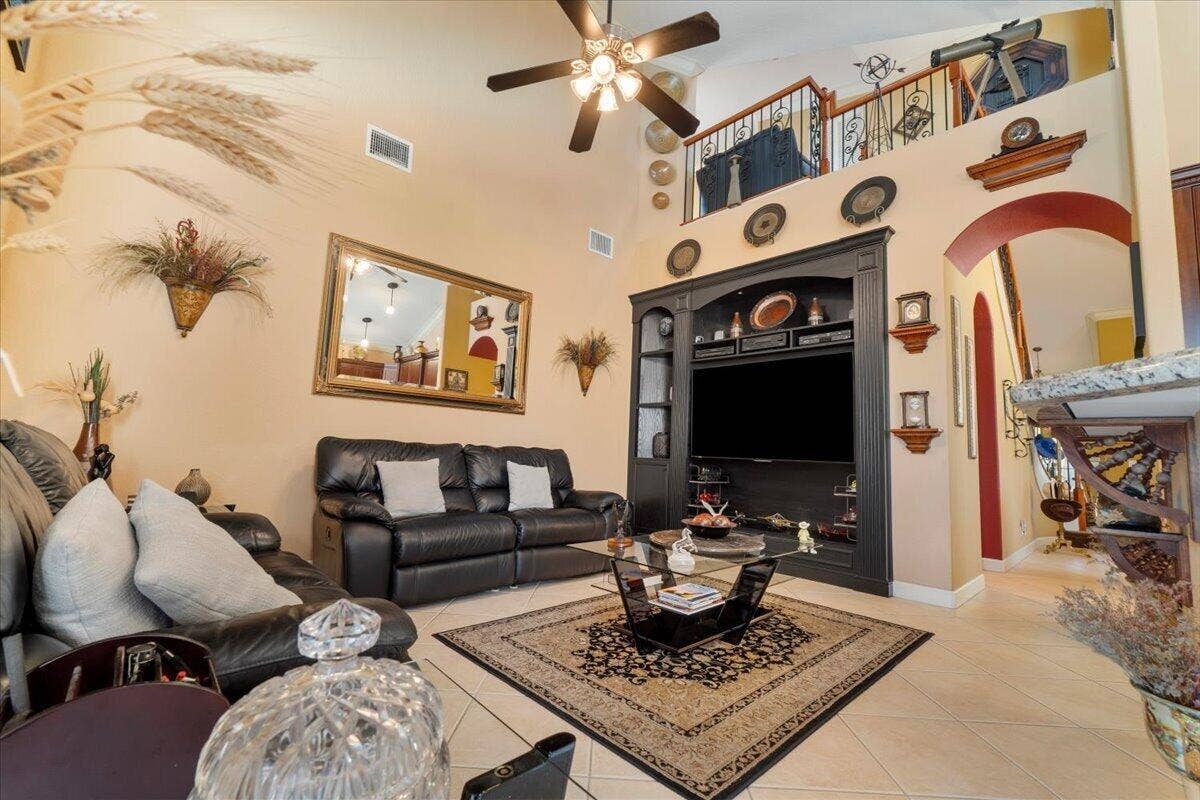 12390 NW 78th Manor, Parkland, FL 33076 Vaulted ceilings adorn this high family room with balcony onto the upstairs loft