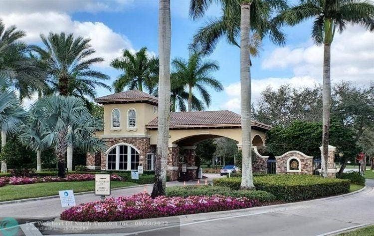 12390 NW 78th Manor, Parkland, FL 33076 One of our 3 guard gate entryways into Heron Bay, 24/7 security with strict photo ID to enter, Roaming guards around every corner of the neighborhood keeping us all safe and sound so we can run, play and be happy and secure in our community of Heron Bay