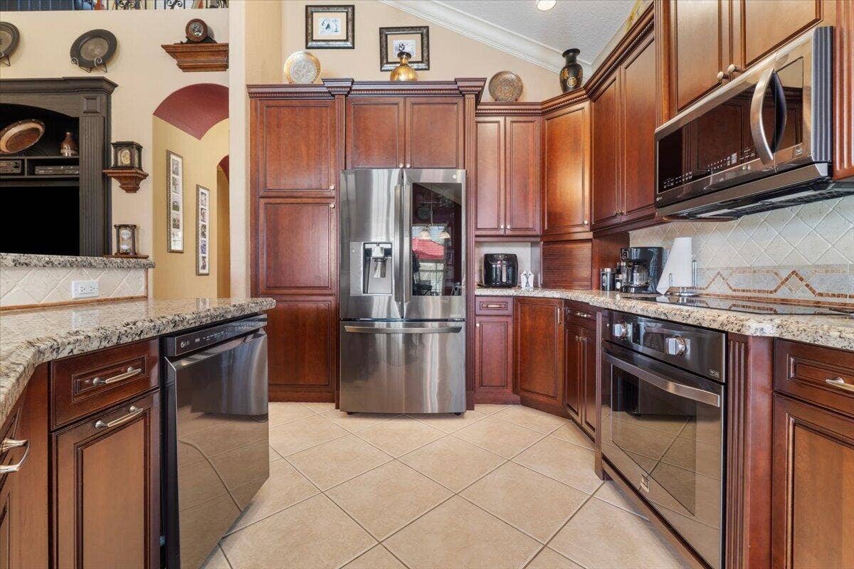 12390 NW 78th Manor, Parkland, FL 33076 All newer top of the line LG Stainless steal appliances, The fridge has a smart fridge remote nad there is an additional fridge/freezer in the garage for if you are working with your tool box and need an additional few drinks from the fridge, Also grate for extra frown food storage and tons of drinks
