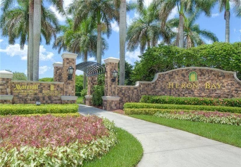 12390 NW 78th Manor, Parkland, FL 33076 The entryway to one of the 3 guard gated strictly secured gates in Heron Bay, Parkland Florida
