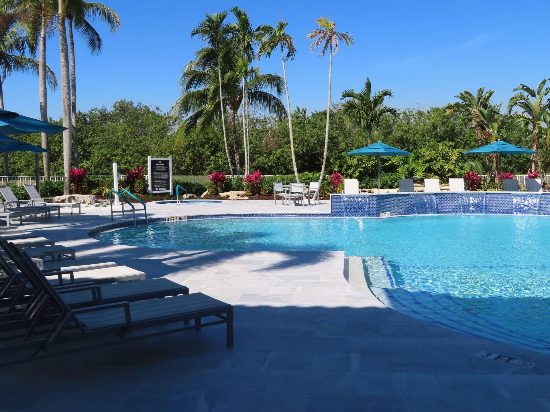 12390 NW 78th Manor, Parkland, FL 33076 A shaded view of the pool at the Commons in the afternoon,