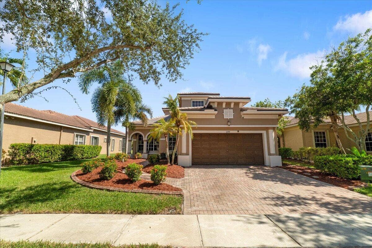 12390 NW 78th Manor, Parkland, FL 33076 Brand new roof (2 months old) cured driveway pavers & newly landscaped gardens