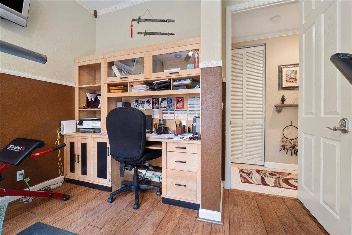 12390 NW 78th Manor, Parkland, FL 33076 The 4th bedroom also has a small office in the gymnasium with great new wood plank flooring