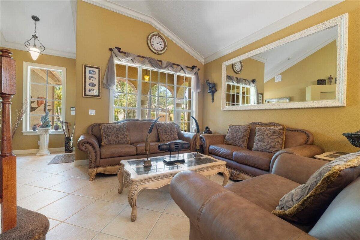 12390 NW 78th Manor, Parkland, FL 33076 The large living room as you walk in form the pivoted front door entry way, 7 inch crown molding throughout