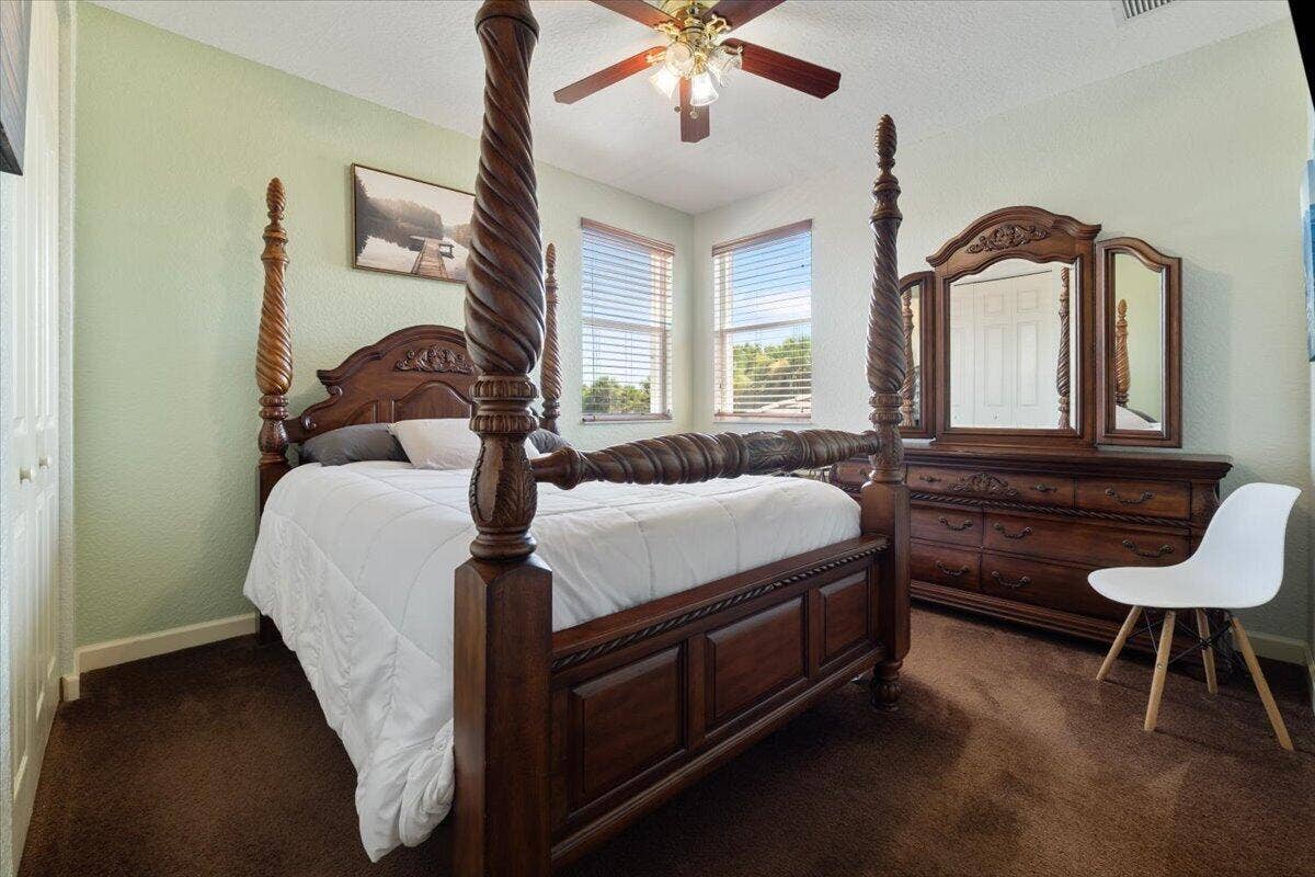 12390 NW 78th Manor, Parkland, FL 33076 One of the upstairs guest bedrooms with pretty corner twin windows, high ceilings and the bedroom furniture comes with it,