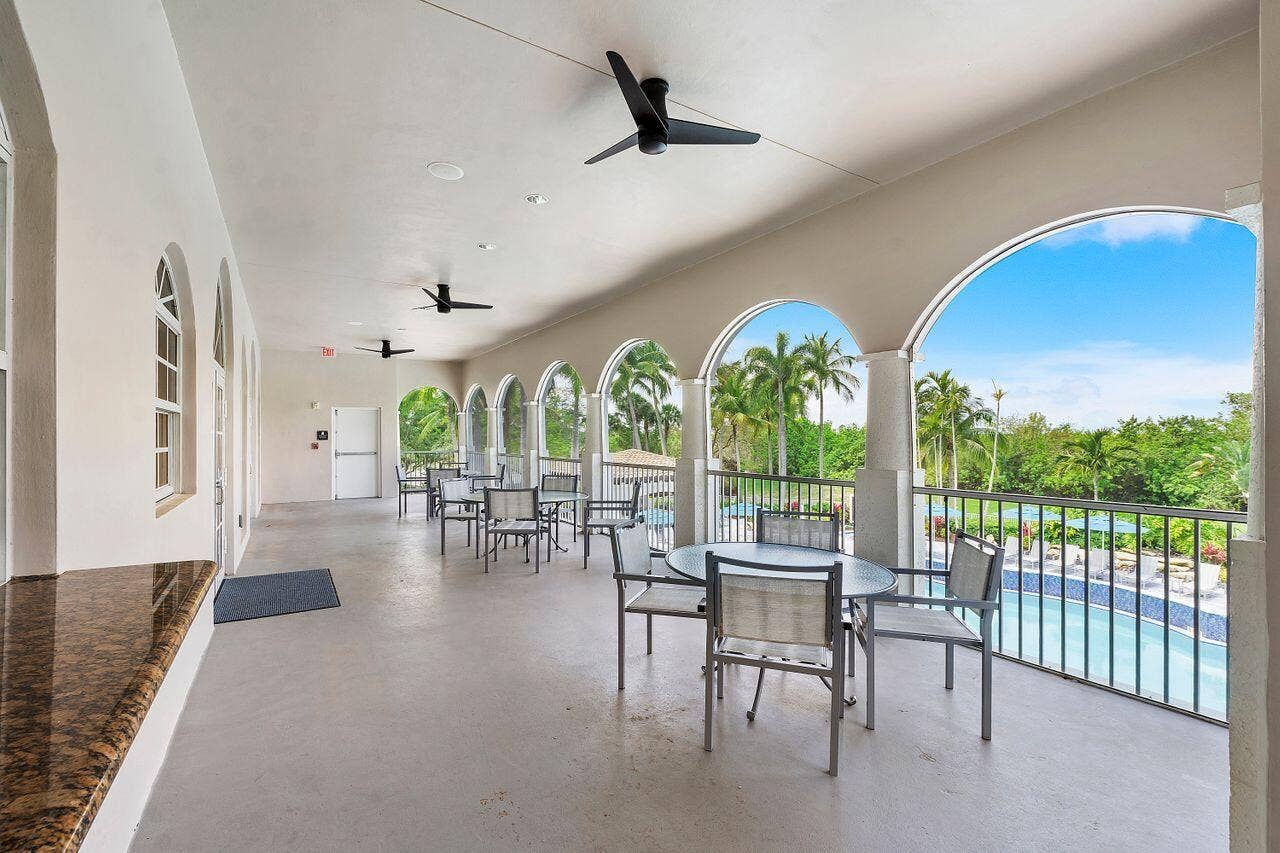 12390 NW 78th Manor, Parkland, FL 33076 The beautiful balcony at the Commons clubhouse, Where you can view miles & miles of nature & wildlife.