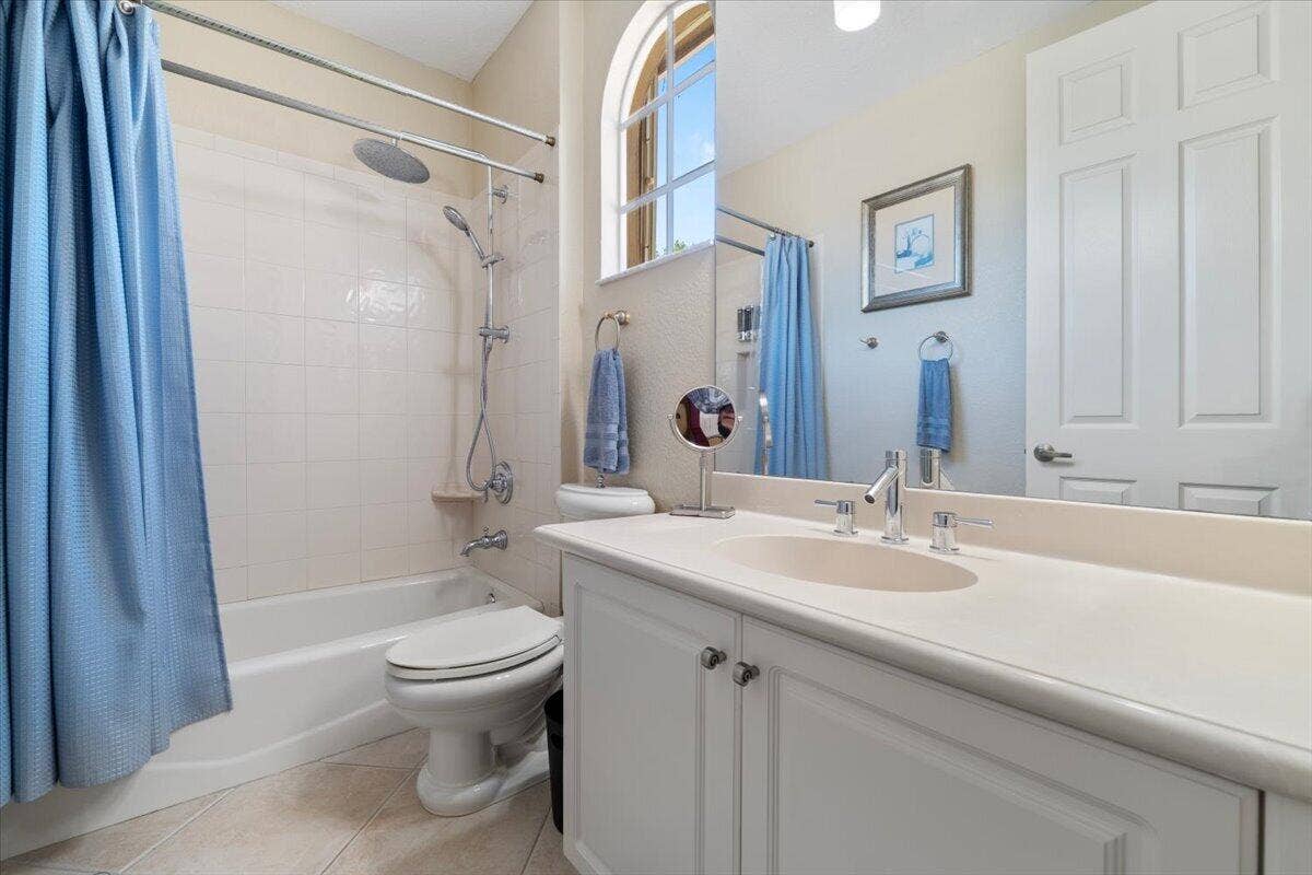 12390 NW 78th Manor, Parkland, FL 33076 upstairs bathroom with all the bells and whistles of the shower and 3 shower heads! A bidet spray water seat and much more.