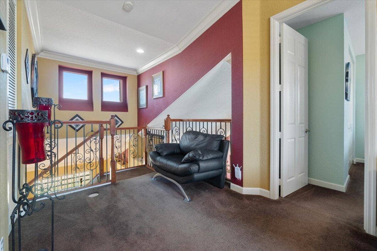 12390 NW 78th Manor, Parkland, FL 33076 We are on the upstairs landing of the loft which has a pretty wrought iron balcony and handrail that looks down onto the Living room and Kitchen area, So your kids can call down (Is dinner ready Mom)