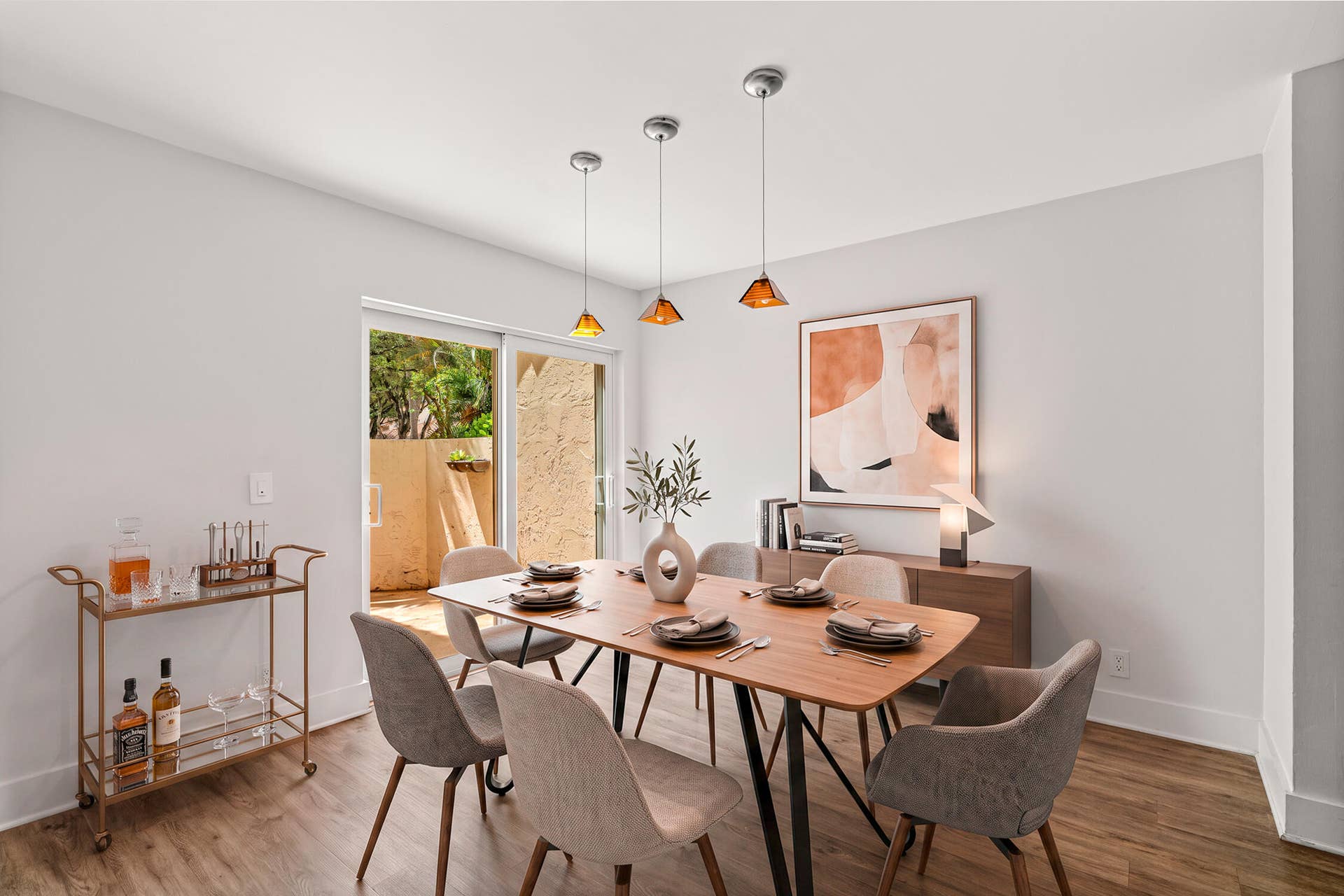 A separated dining room that connects with the kitchen an a small outside courtyard
