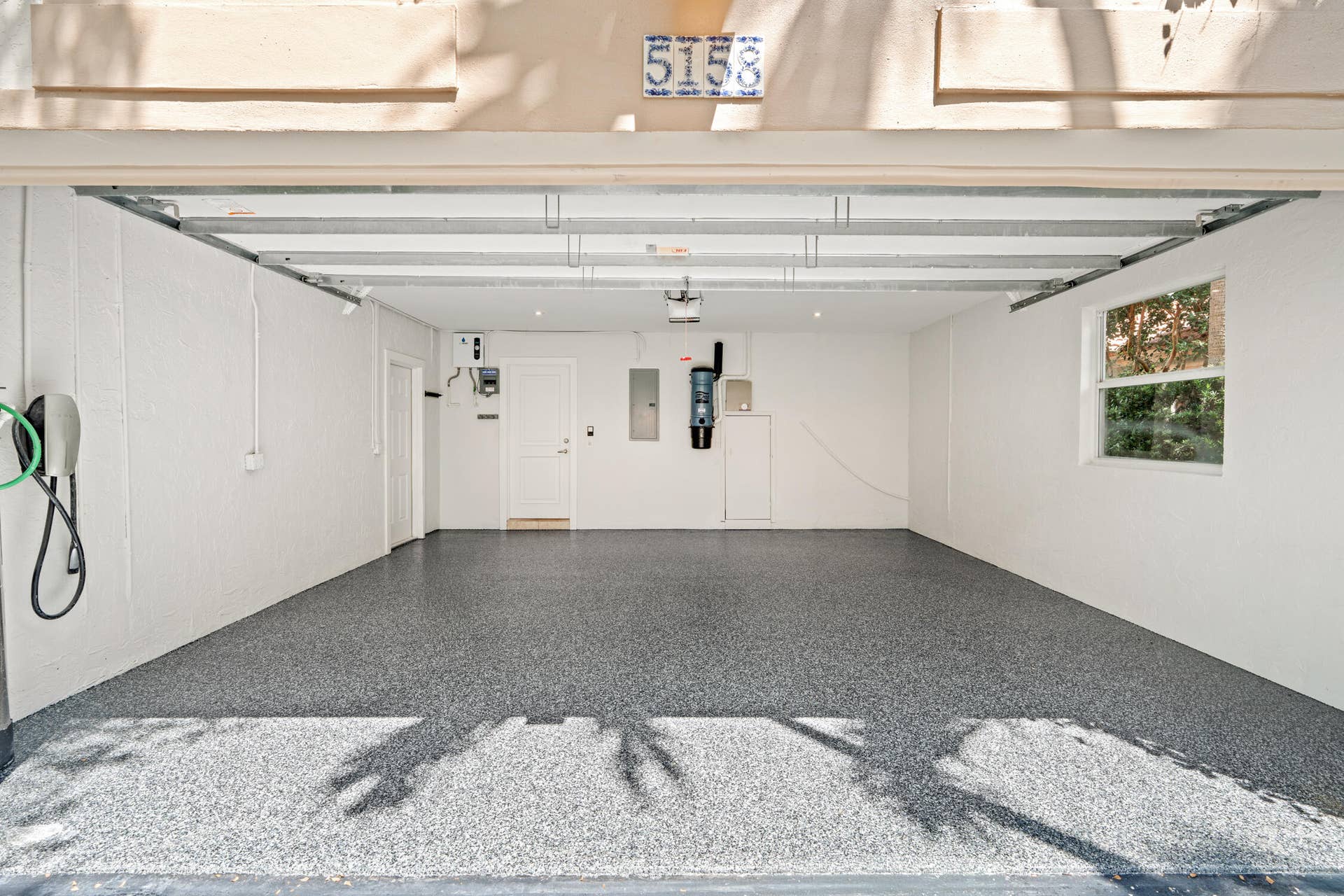 The garage has a brand new epoxy floor with recessed down lights.