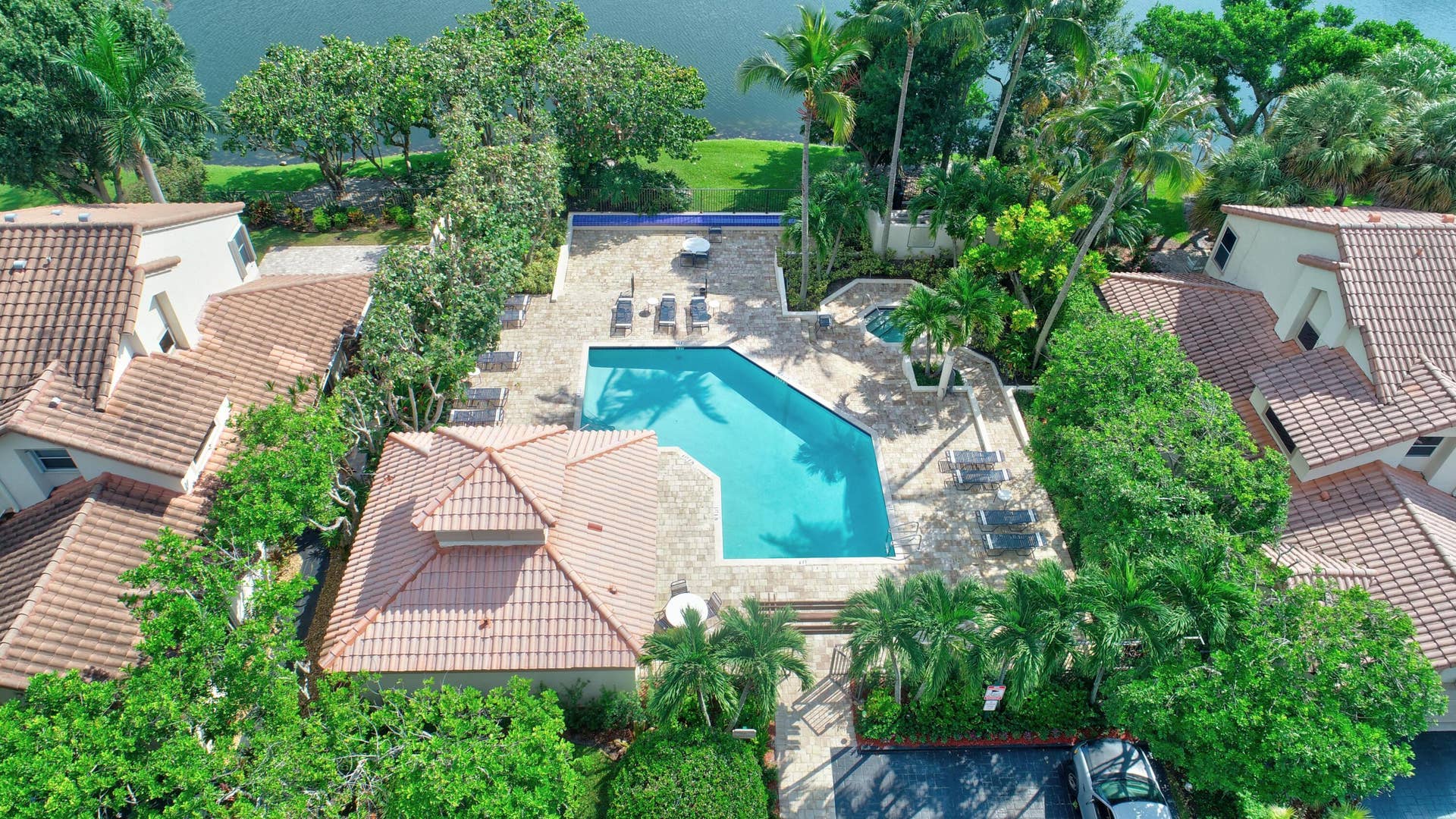 The community pool has a jacuzzi and a bar area for entertainment.