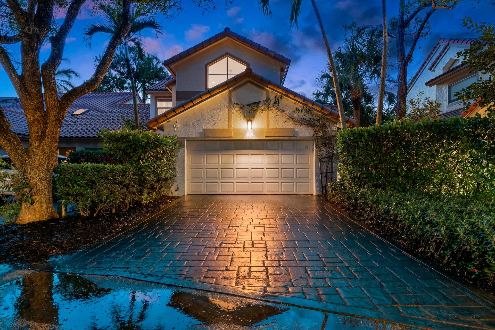 The house as seen from the front at night.