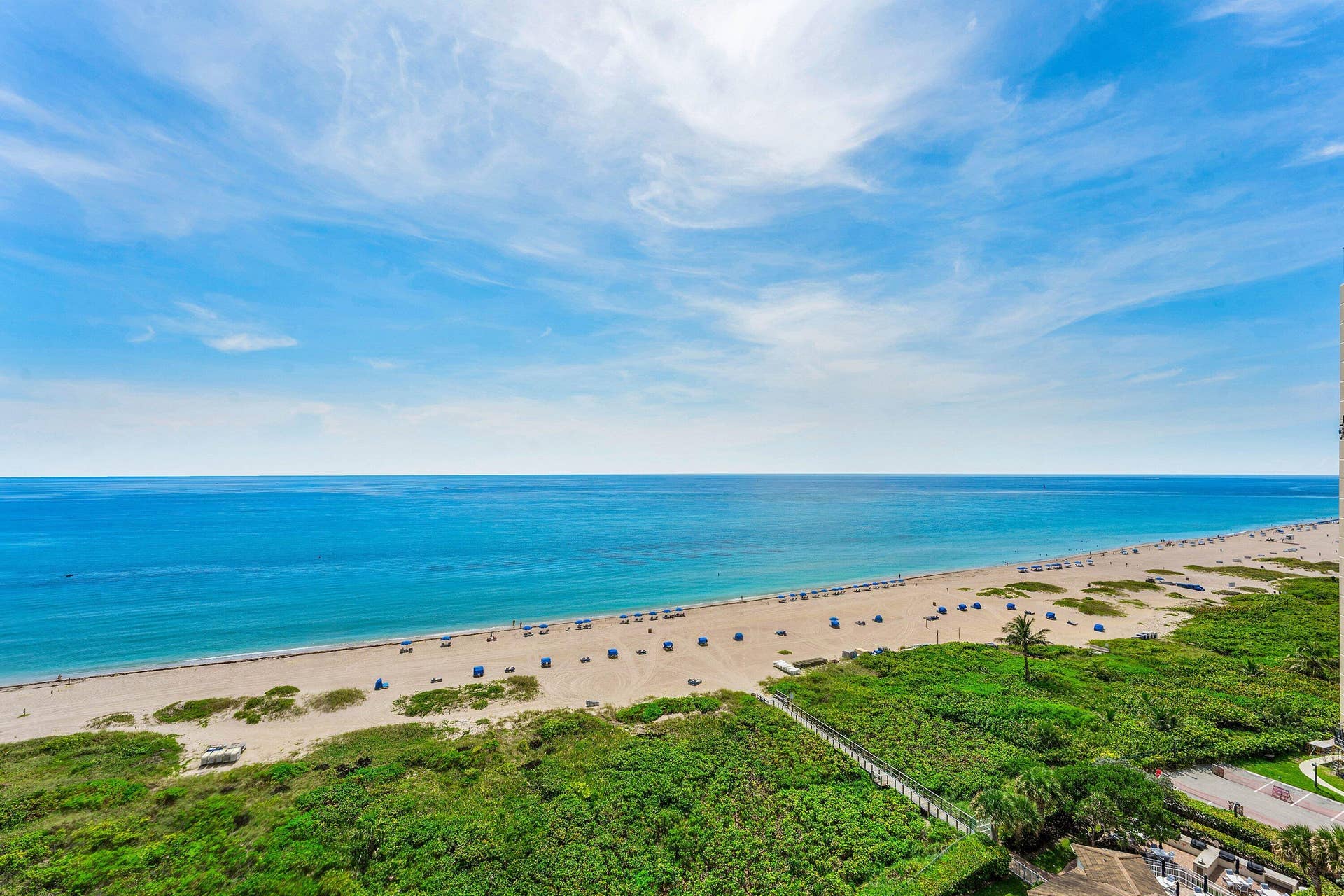 Unobstructed Atlantic Ocean and beach views stretch along the Singer Island shoreline.