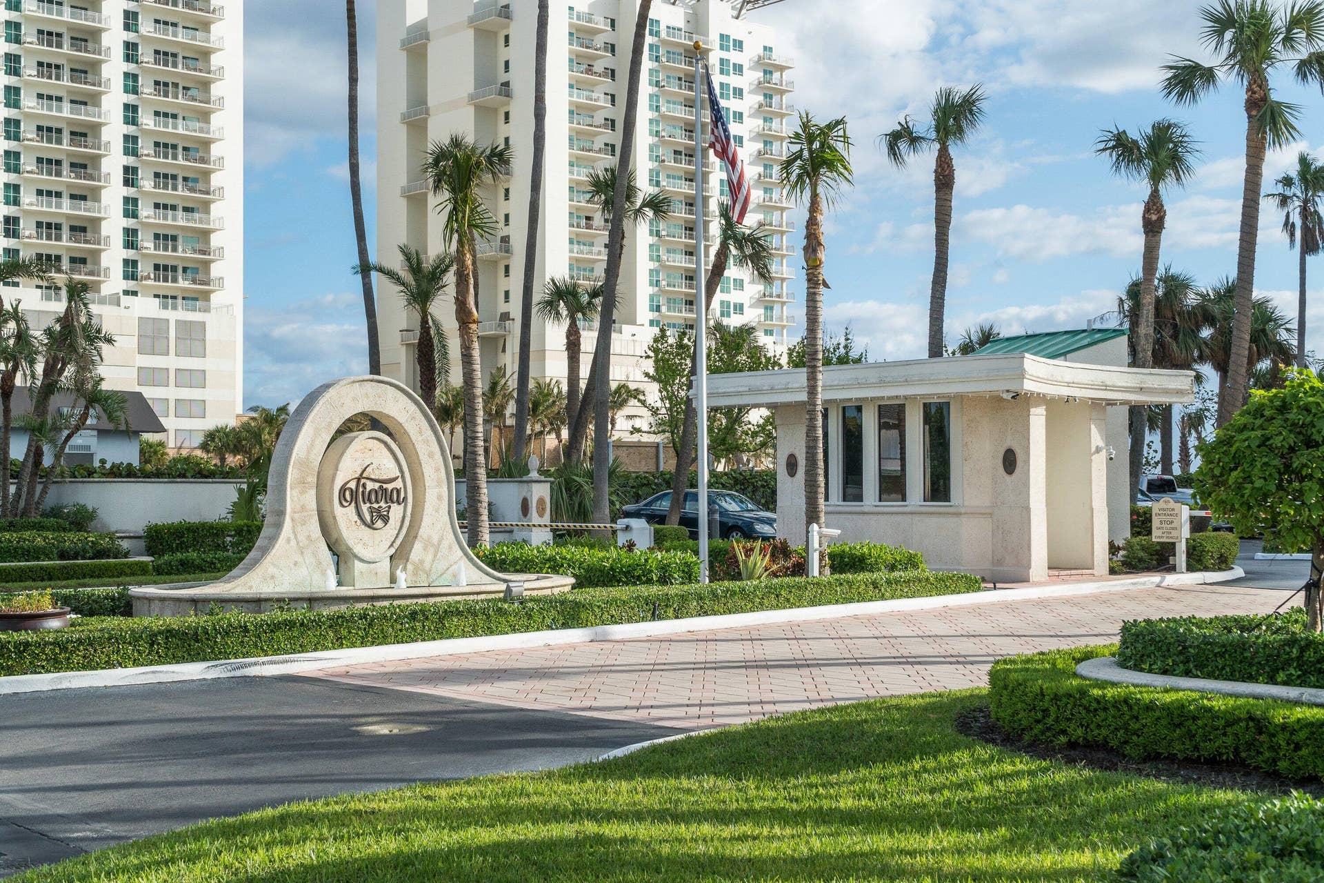The gated Tiara entrance provides a landscaped arrival along North Ocean Drive.
