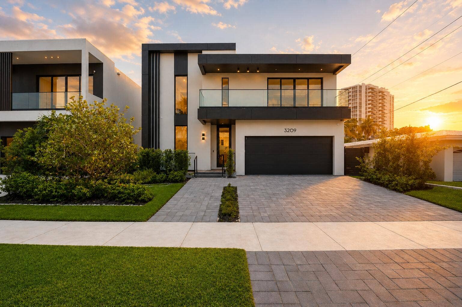 Modern architecture featuring a smooth stucco exterior and dark trim accents