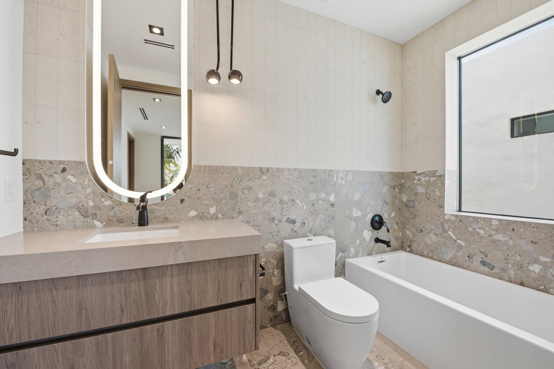 Floating vanity with wood-finish cabinetry and integrated sink