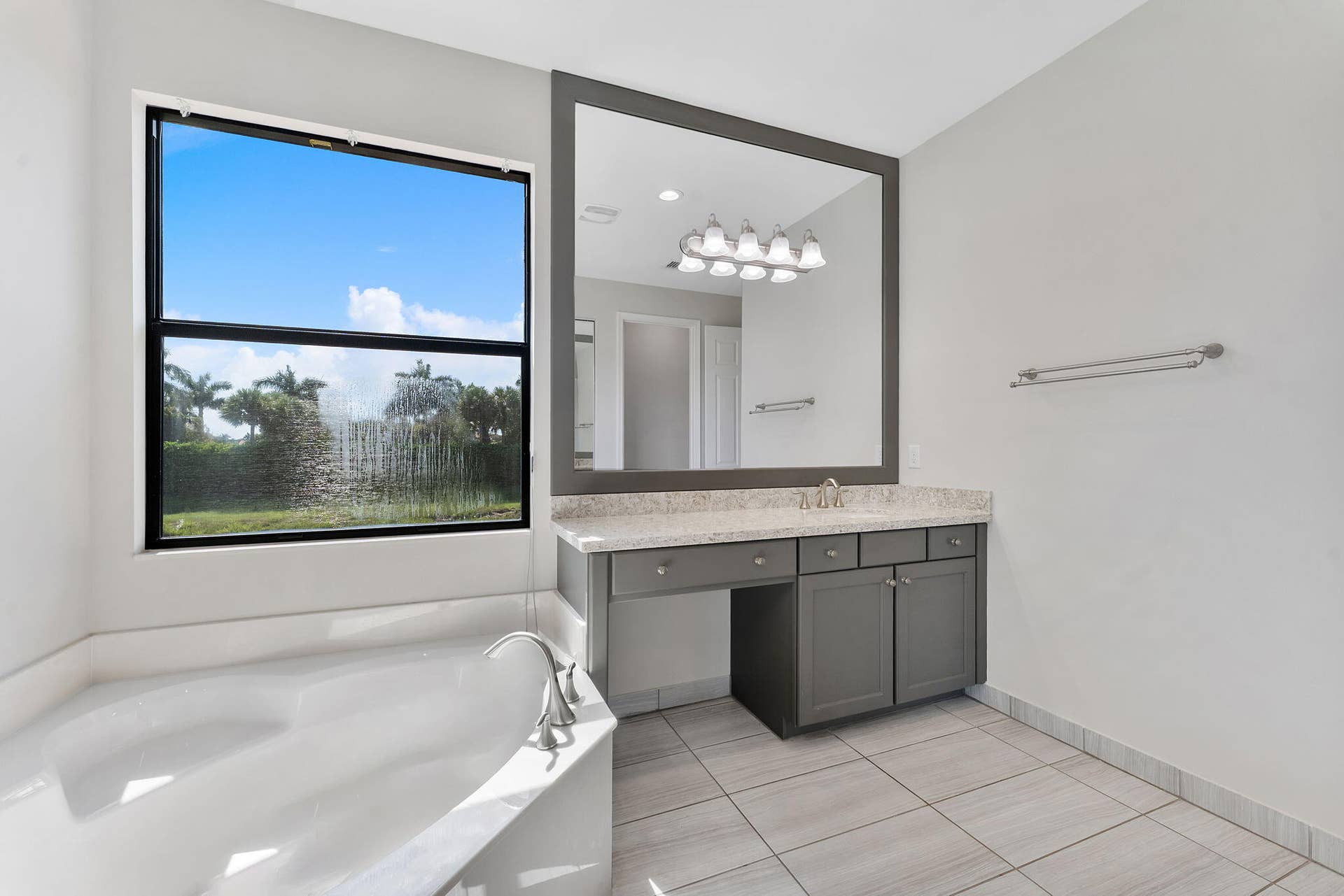 14545 Alabaster Avenue, Delray Beach, FL 33446 Roman tub with nature view.