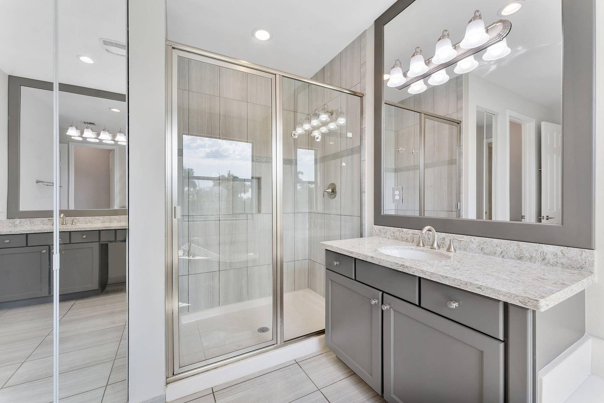 14545 Alabaster Avenue, Delray Beach, FL 33446 Primary ensuite with dualing vanities, glass shower and roman tub.