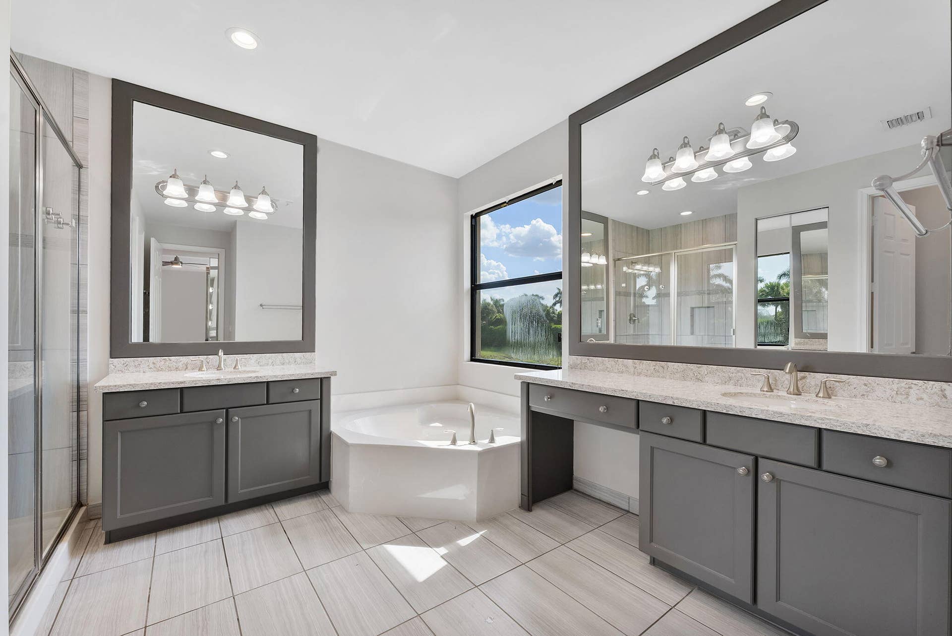 14545 Alabaster Avenue, Delray Beach, FL 33446 Primary ensuite with dualing vanities, glass shower and roman tub.