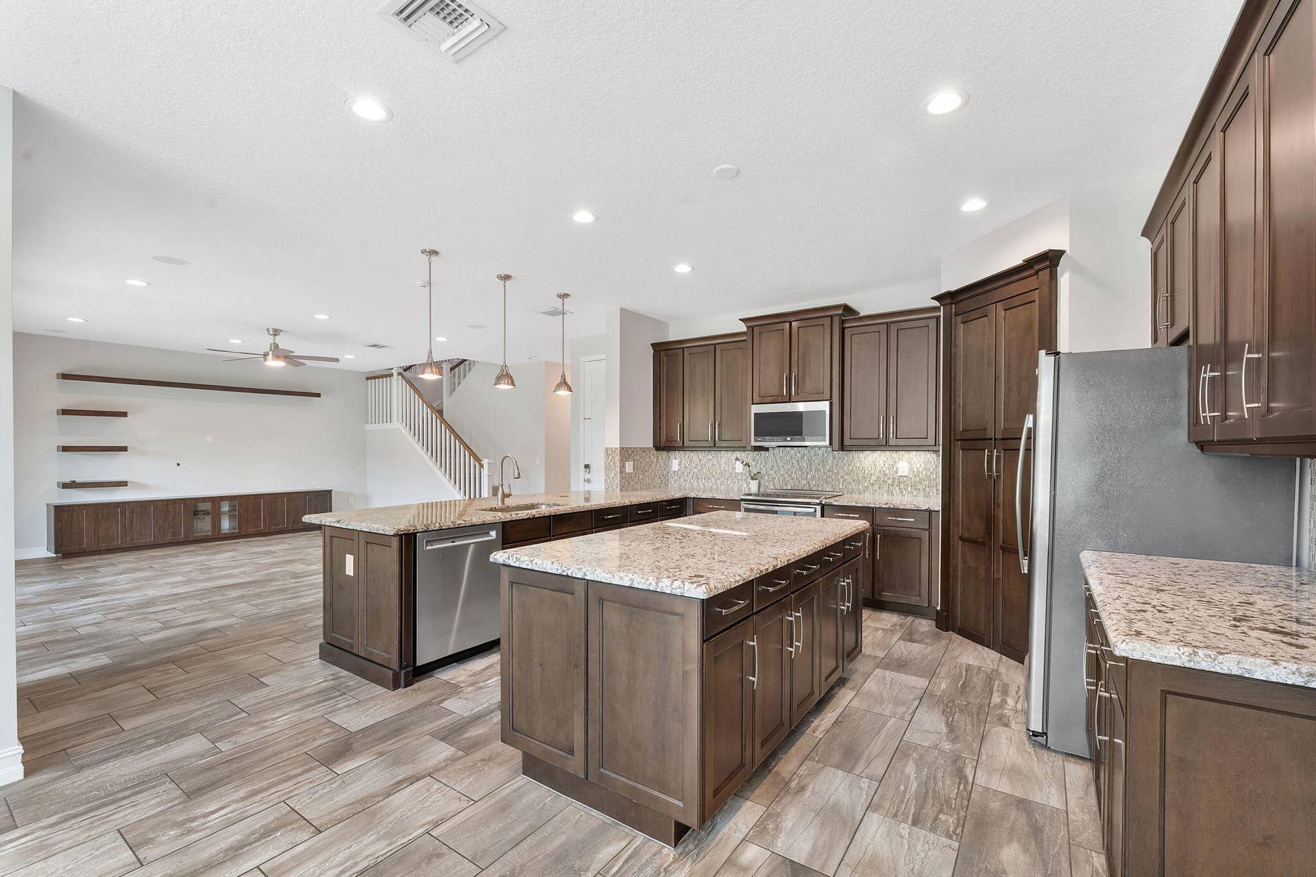 14545 Alabaster Avenue, Delray Beach, FL 33446 Open concept kitchen looks into living room and dining area.