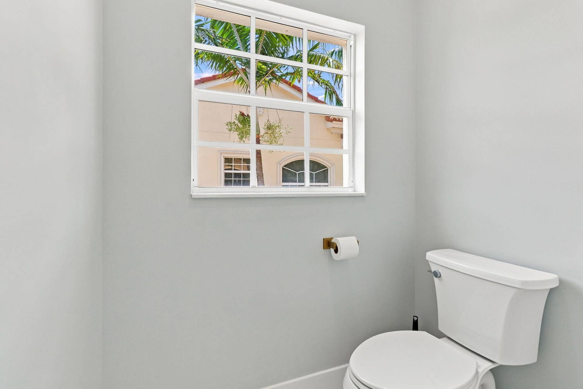 White framed window with grid inserts