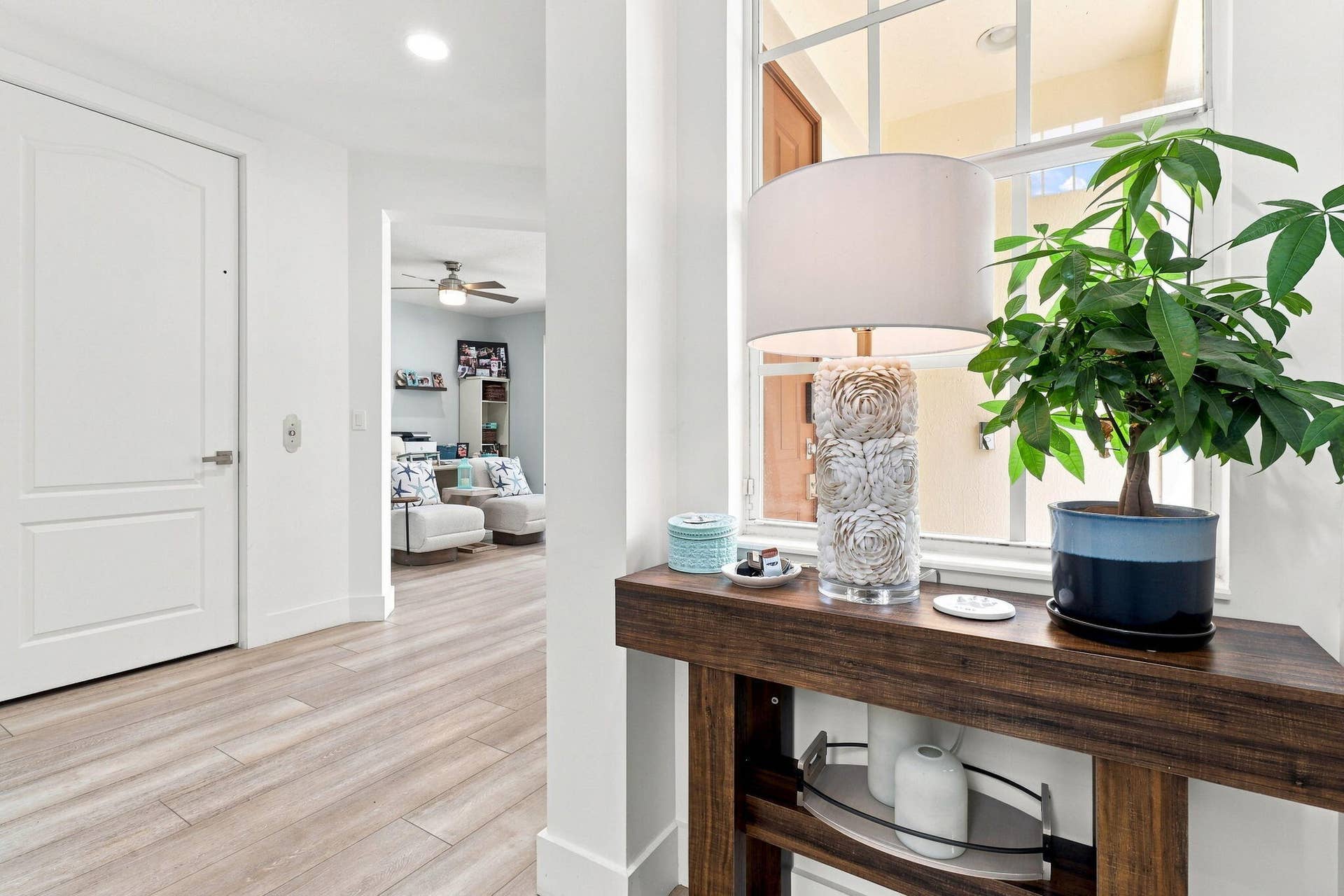 Luxury vinyl flooring complements the crisp bright walls and doors