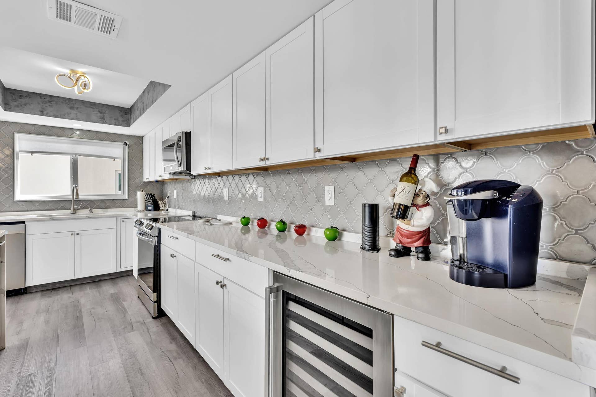 600 N VICTORIA Terrace, Fort Lauderdale, FL 33304 Kitchen Entryway with stainless steel appliances and wine fridge.