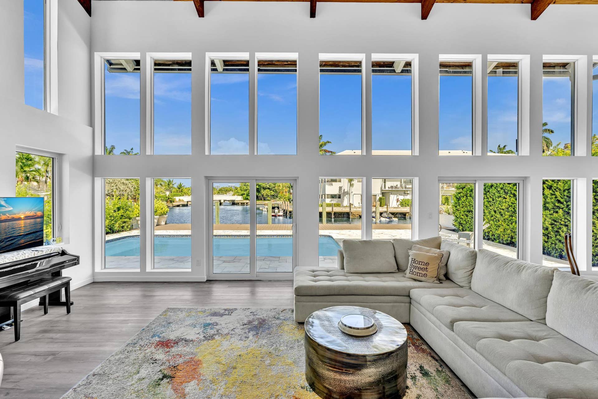 600 N VICTORIA Terrace, Fort Lauderdale, FL 33304 Vaulted ceiling living room with floor to ceiling windows.