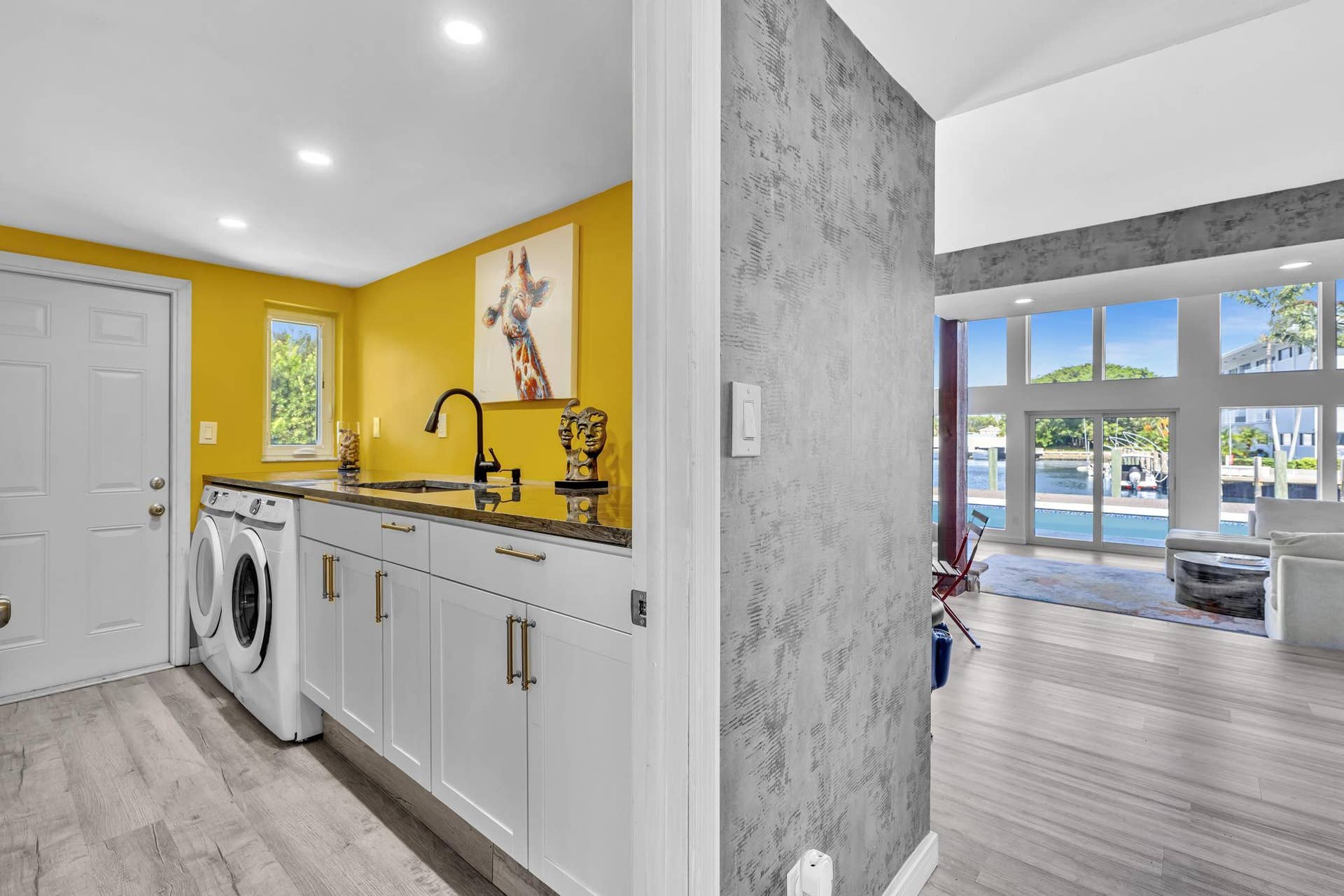 600 N VICTORIA Terrace, Fort Lauderdale, FL 33304 Laundry Room with washer and dryer, built in sink, and garage access