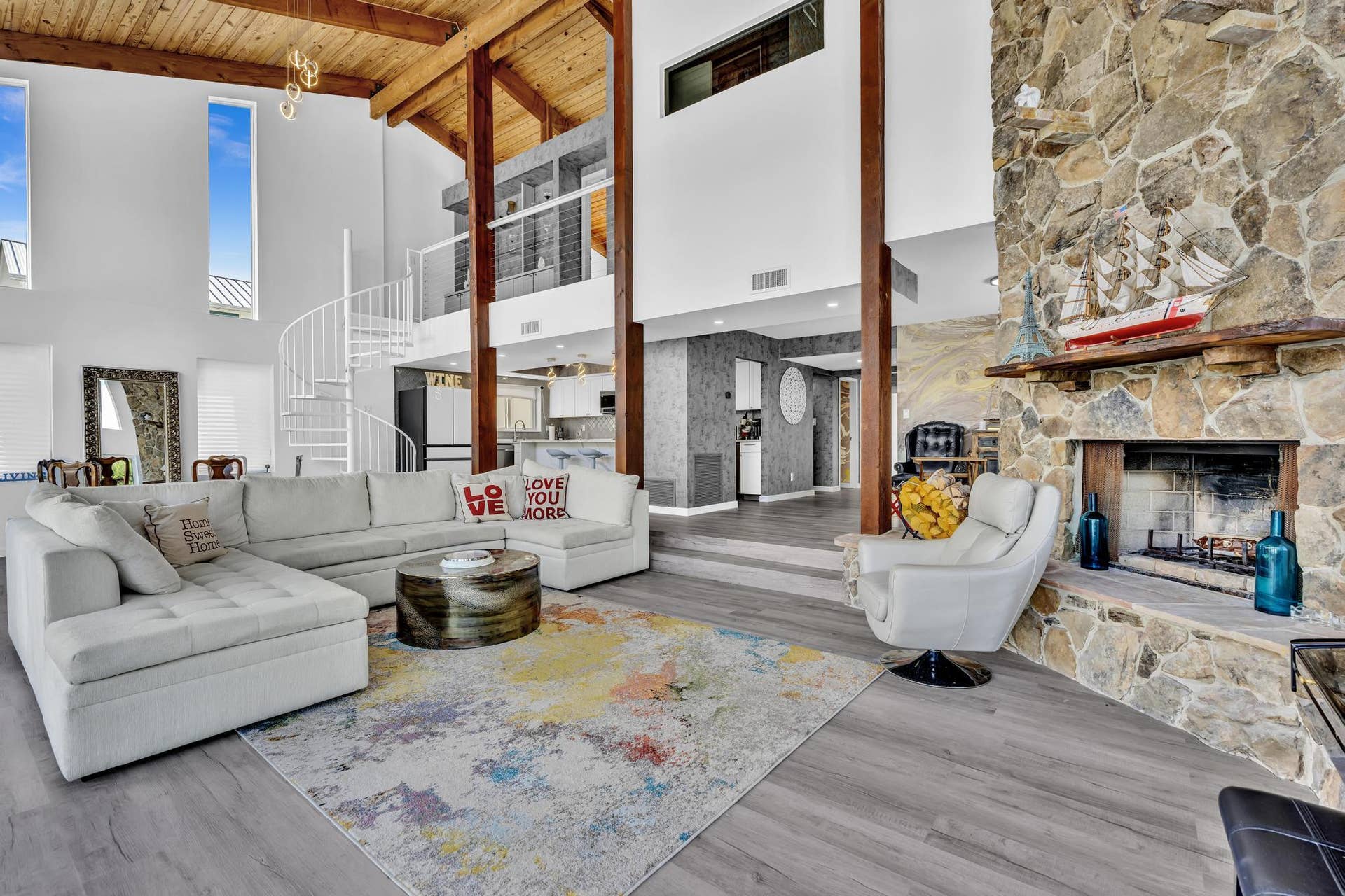 600 N VICTORIA Terrace, Fort Lauderdale, FL 33304 Vaulted ceiling living room with floor to ceiling windows.