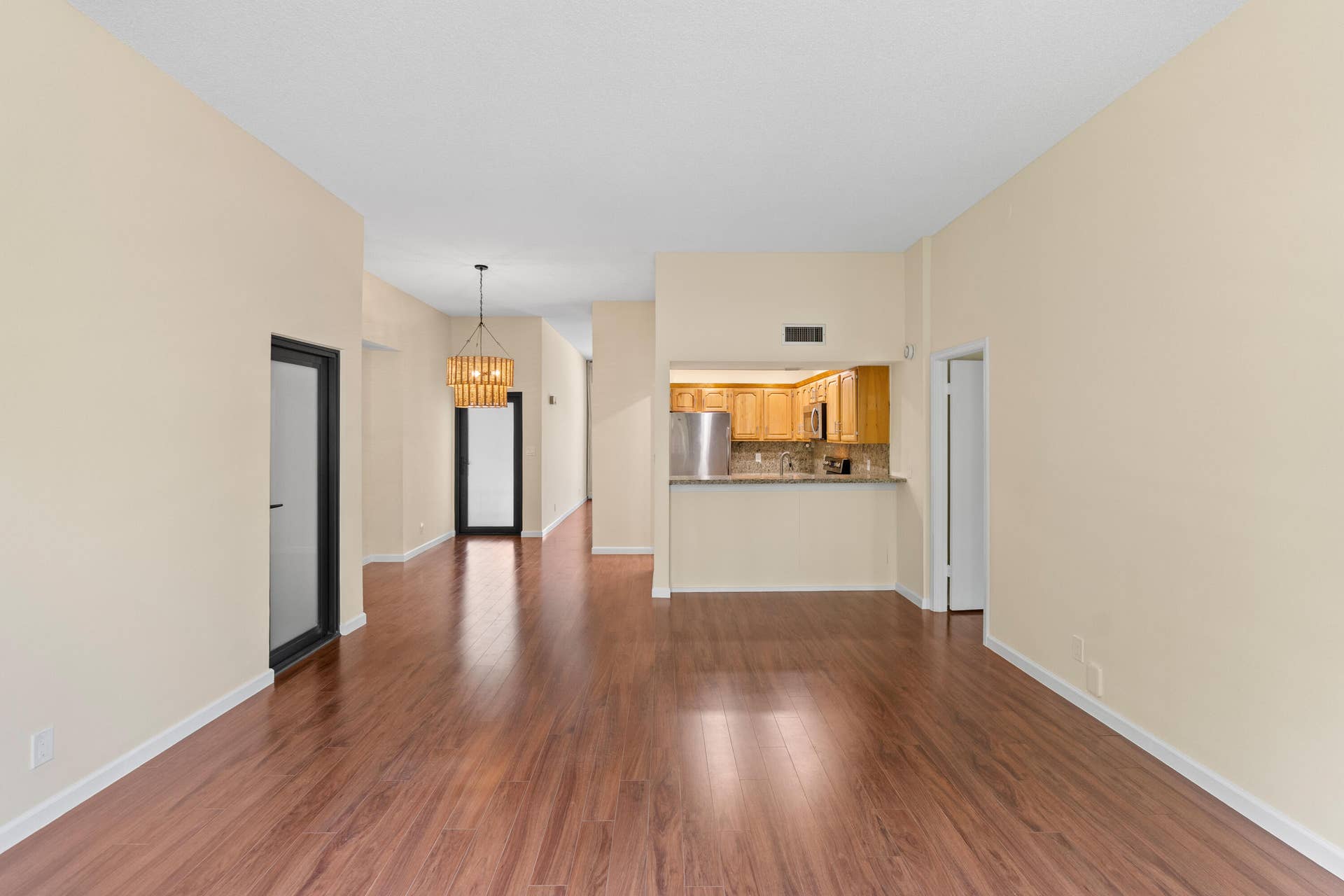 Family room with exterior door that leads to stairs down to the garden patio