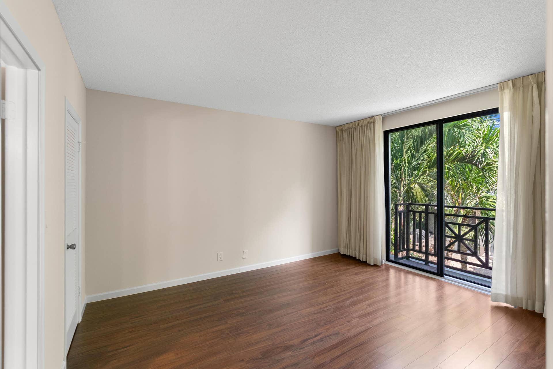 Primary bedroom with sliders