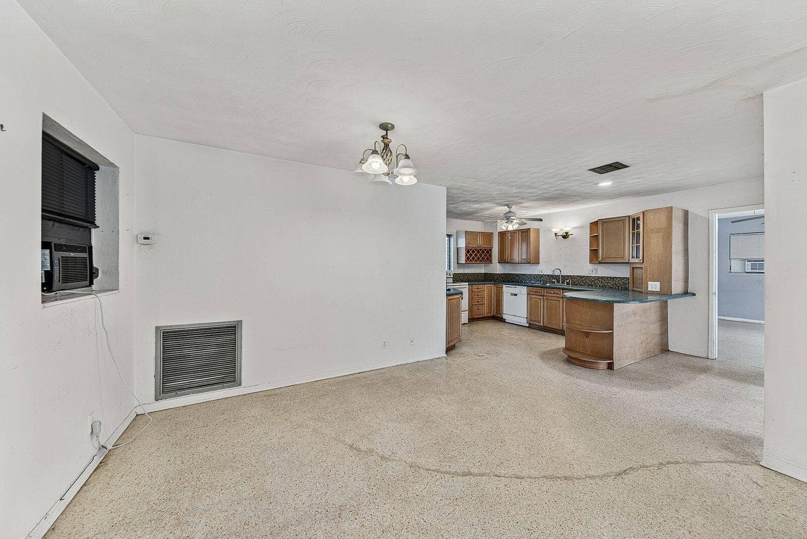 201 NE 29th Street, Wilton Manors, FL 33334 Open dining and kitchen arrangement offers flexibility for renovation and contemporary redesign.