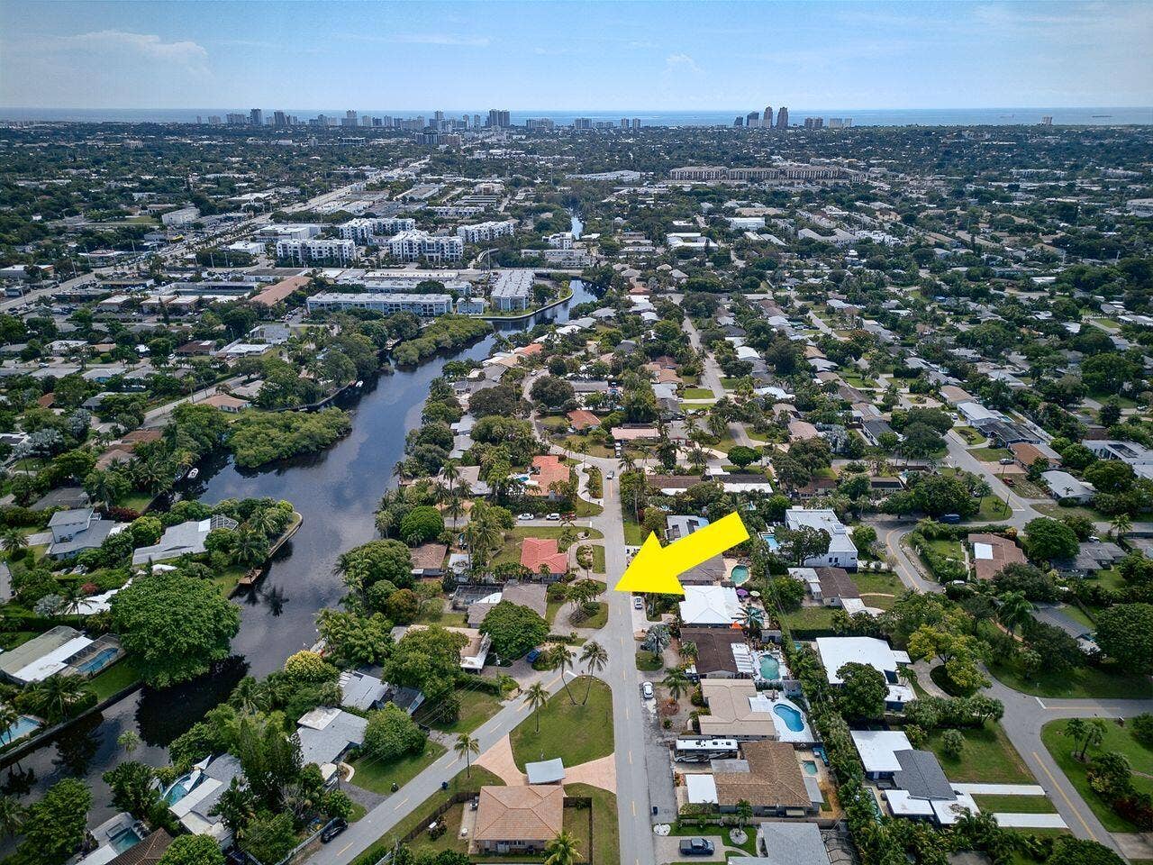 201 NE 29th Street, Wilton Manors, FL 33334 Aerial view identifies the property within its waterfront neighborhood, with the Atlantic Ocean and coastal skyline visible in the distance.