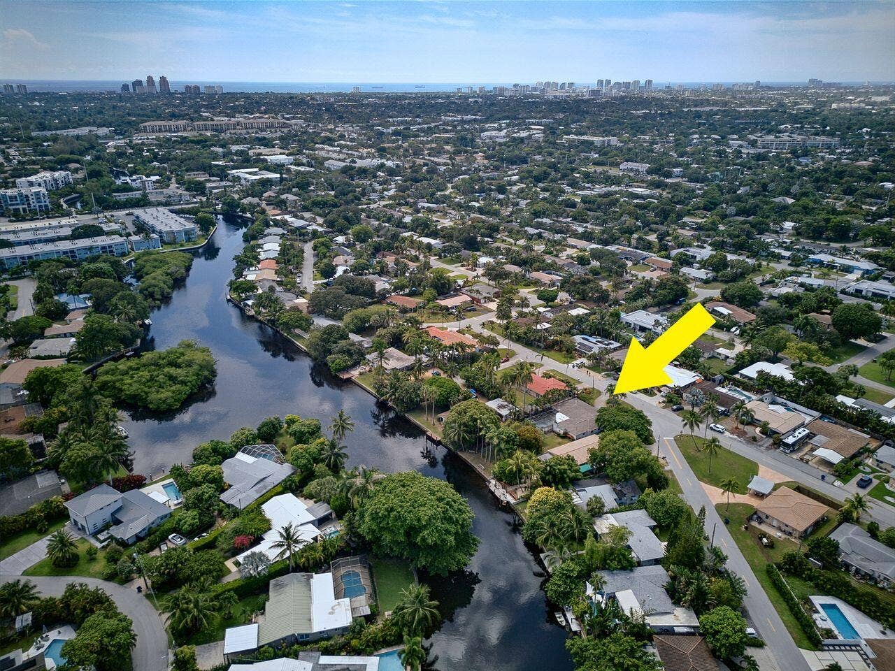 201 NE 29th Street, Wilton Manors, FL 33334 Expansive aerial perspective highlights the propertys position near the water and its established tropical surroundings.