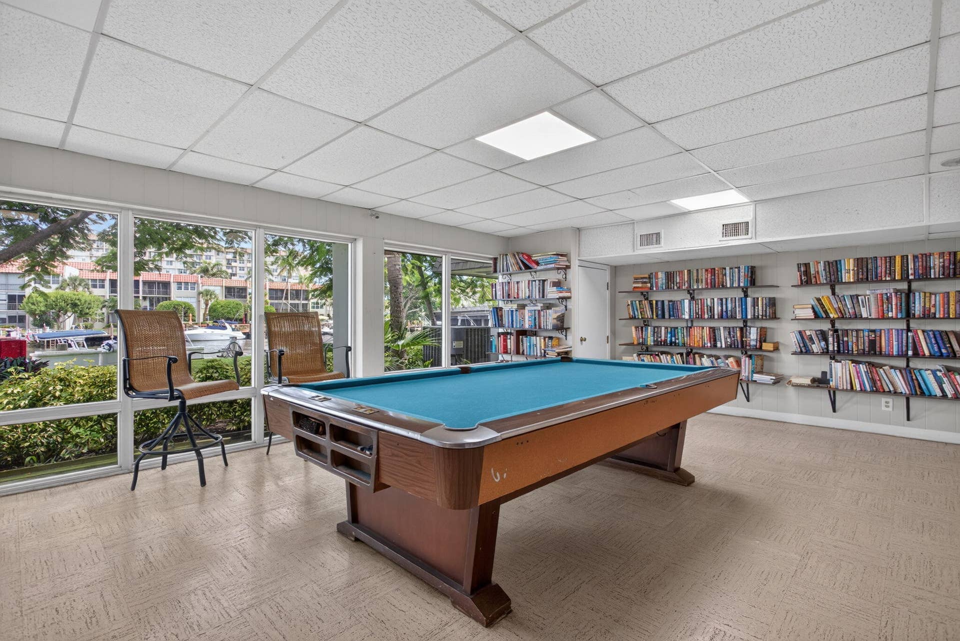 801 S Federal Highway, #1103, Pompano Beach, FL 33062 Recreational room with a billiards table, expansive wall-to-wall windows, and built-in shelving