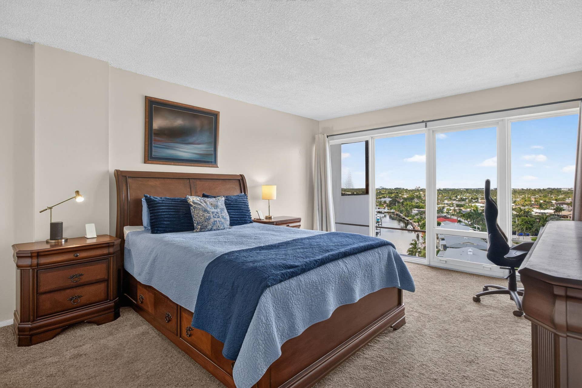 801 S Federal Highway, #1103, Pompano Beach, FL 33062 Floor-to-ceiling windows, soft carpet flooring, light neutral wall finishes, and a sliding glass door to a balcony