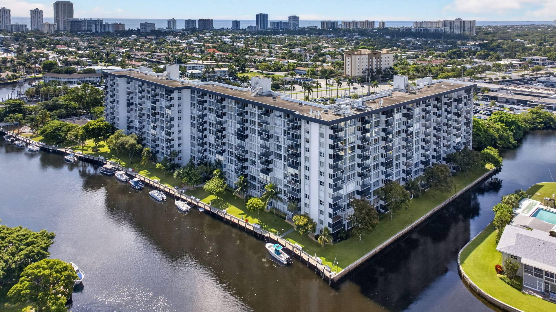 801 S Federal Highway, #1103, Pompano Beach, FL 33062 Multi-story building with multiple balconies, adjacent to a waterway