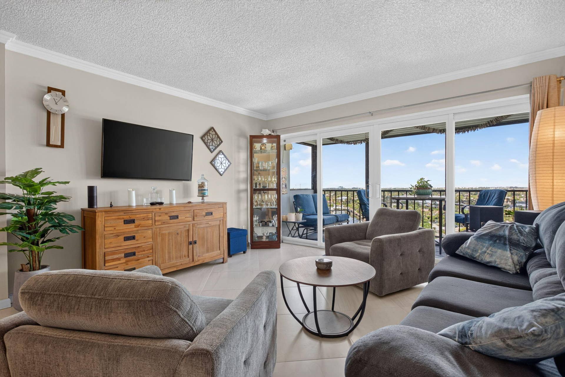 801 S Federal Highway, #1103, Pompano Beach, FL 33062 Sliding glass doors, crown molding, and tiled flooring