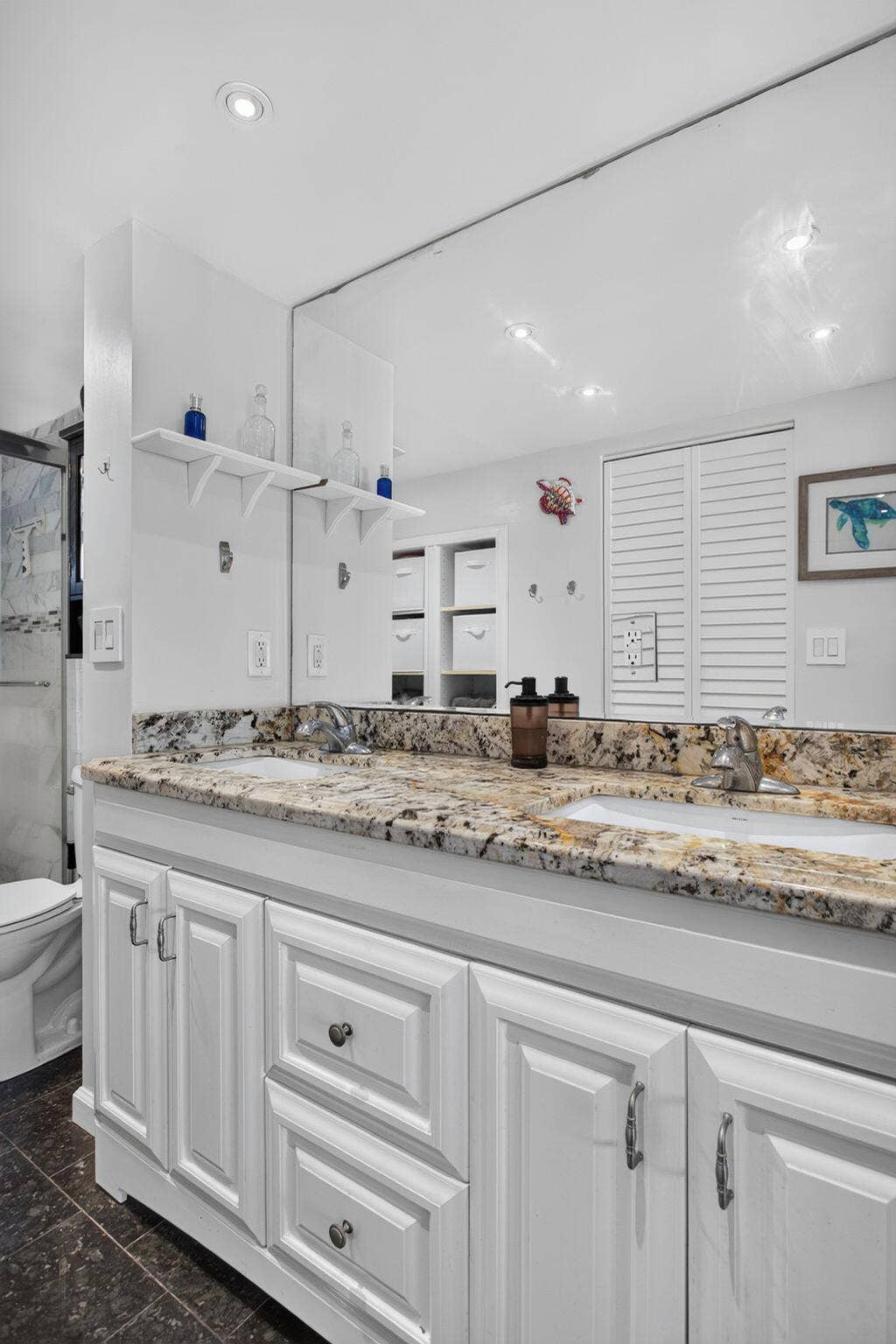 801 S Federal Highway, #1103, Pompano Beach, FL 33062 Double vanity with white cabinetry, integrated sinks, and a stone-finish countertop
