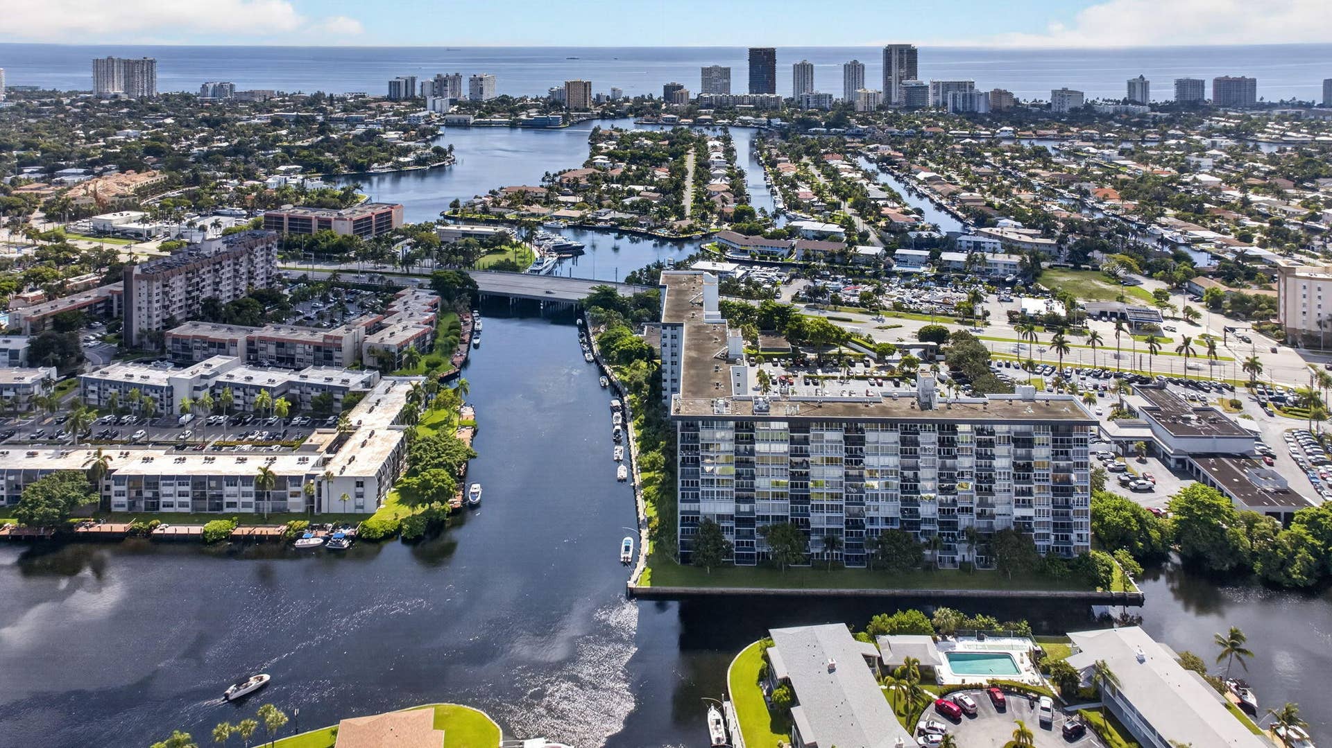 801 S Federal Highway, #1103, Pompano Beach, FL 33062 Aerial perspective showcasing extensive waterfront, surrounding residential properties, urban skyline, and distant ocean