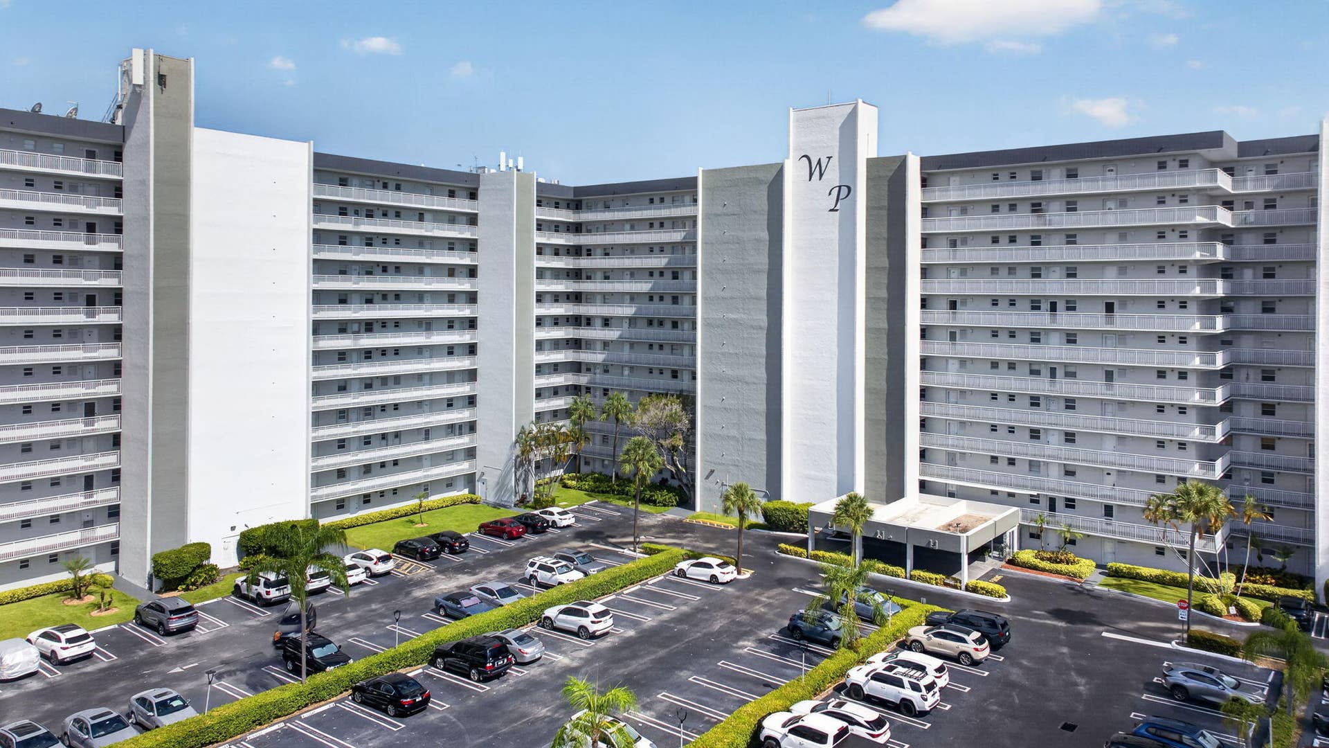 801 S Federal Highway, #1103, Pompano Beach, FL 33062 Multi-story residential building with private balconies and a covered entrance