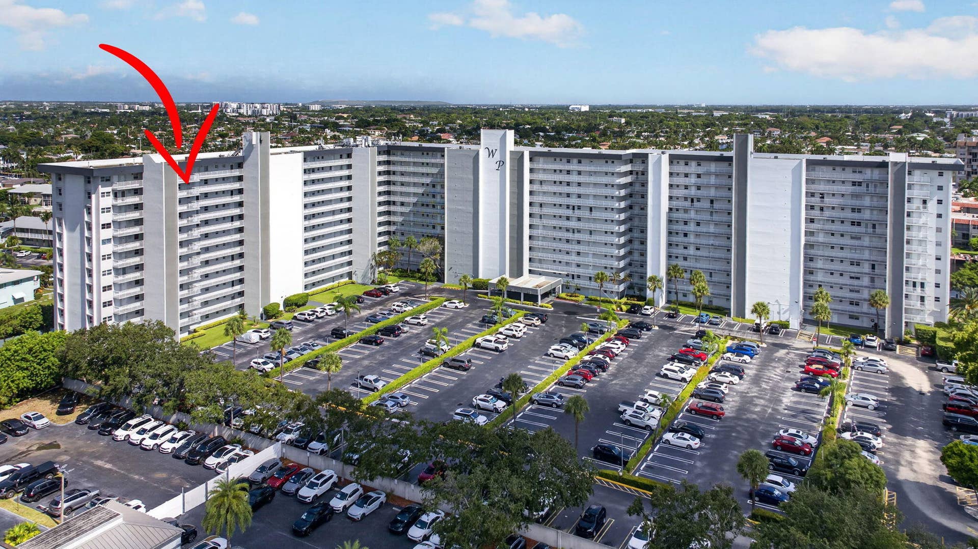 801 S Federal Highway, #1103, Pompano Beach, FL 33062 High-rise multifamily structure featuring multiple balconies and extensive on-site surface parking