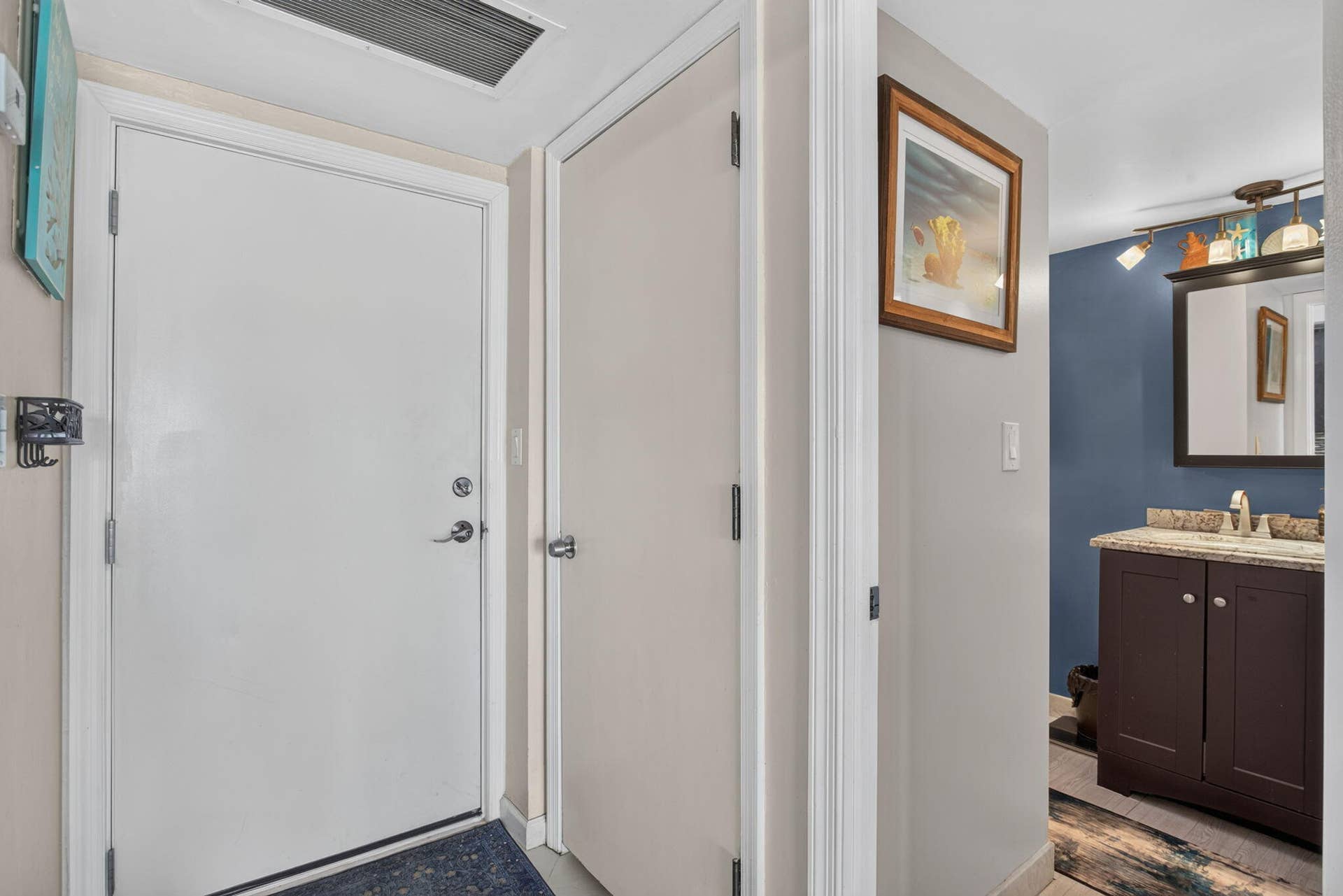 801 S Federal Highway, #1103, Pompano Beach, FL 33062 Bathroom featuring a dark wood-finish vanity, light-toned countertop, and recessed sink