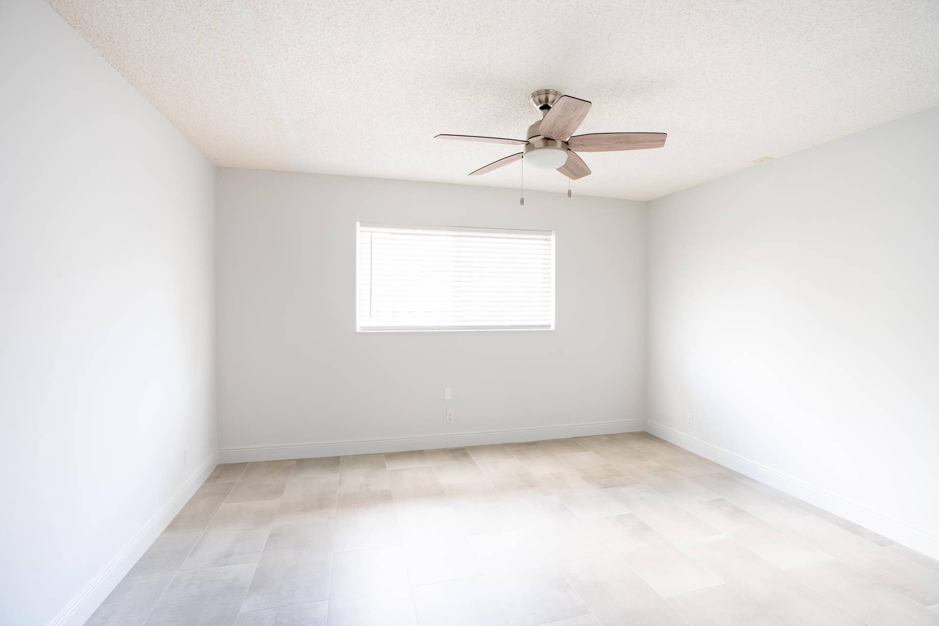 17 SE 8TH Terrace, Deerfield Beach, FL 33441 Bright interior with wood-finish flooring, a window with blinds, and a ceiling fan with light